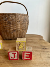 Load image into Gallery viewer, vintage disney blocks in an oak splint basket
