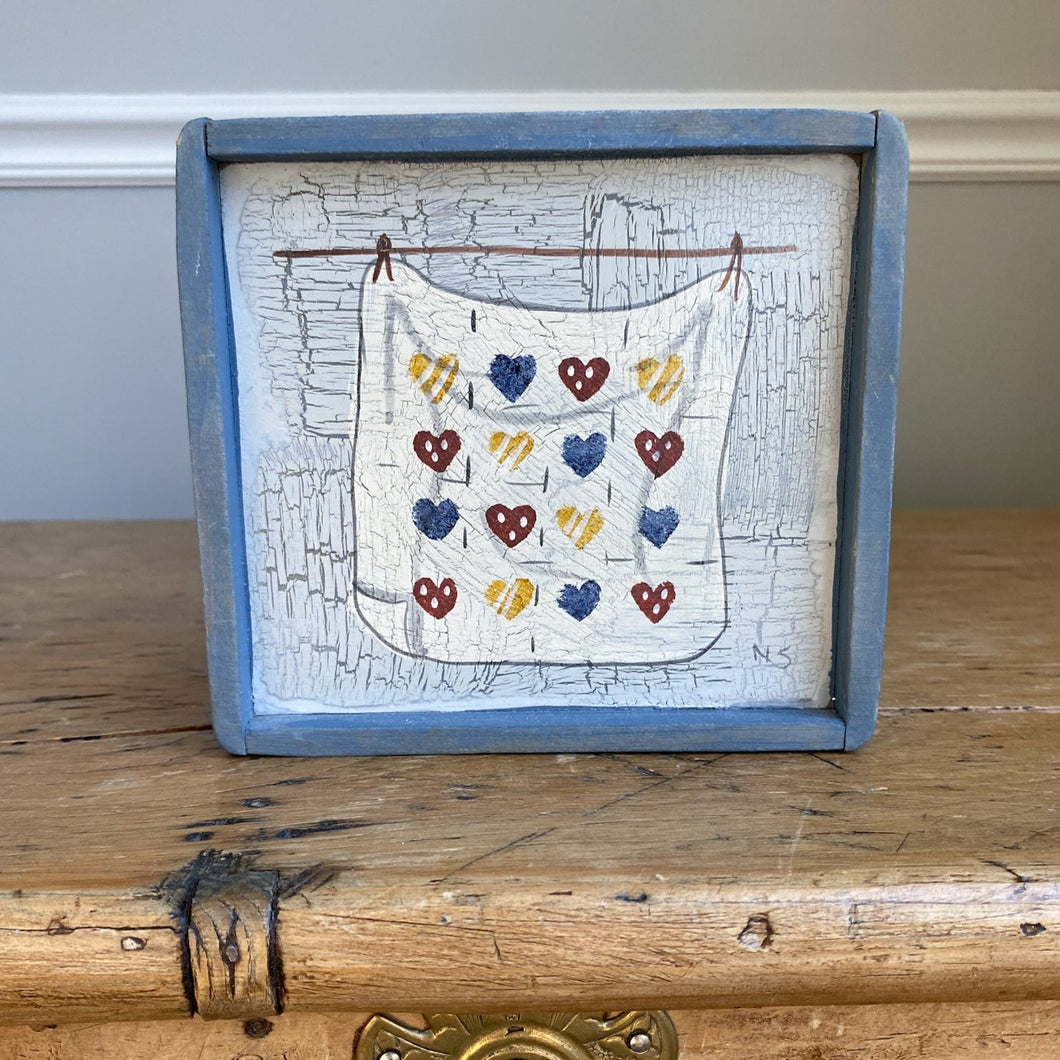 wooden-framed heart quilt art